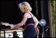 A person playing guitar on stage

Description automatically generated with low confidence