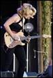 A person playing a guitar

Description automatically generated with medium confidence