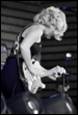 A person playing a guitar

Description automatically generated with medium confidence