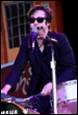 A person singing into a microphone

Description automatically generated with medium confidence