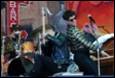 A group of people playing instruments

Description automatically generated with medium confidence