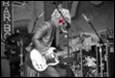 A person playing a guitar

Description automatically generated with medium confidence