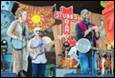 A group of people playing instruments

Description automatically generated