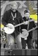 A picture containing musical instrument, person, clothing, guitar

Description automatically generated