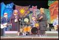 A group of people on a stage

Description automatically generated