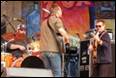 A group of people playing instruments

Description automatically generated with medium confidence