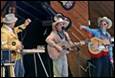 A group of people playing instruments

Description automatically generated