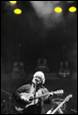 A person playing a guitar

Description automatically generated