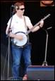 A person playing a banjo

Description automatically generated