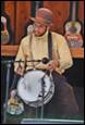 A person playing a drum

Description automatically generated