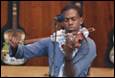 A person playing a violin

Description automatically generated
