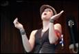 A person with her hands up

Description automatically generated
