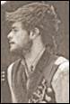 A person with a beard

Description automatically generated