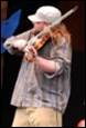 A person playing a violin

Description automatically generated