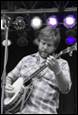 A person playing a guitar

Description automatically generated