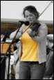 A person playing a violin

Description automatically generated