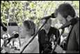 A group of people playing instruments

Description automatically generated