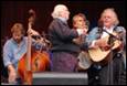 A group of people playing instruments

Description automatically generated