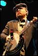 A person playing a banjo

Description automatically generated