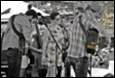 A group of people standing in a line

Description automatically generated