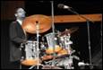 A person playing a drum set

Description automatically generated