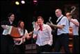 A group of men playing instruments

Description automatically generated