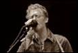 A person singing into a microphone

Description automatically generated