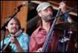 A group of men playing instruments

Description automatically generated