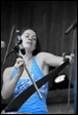A person holding a microphone

Description automatically generated