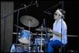A person playing a drum set

Description automatically generated