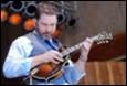 A person playing a guitar

Description automatically generated
