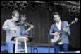 A group of people playing instruments

Description automatically generated