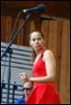 A person in a red dress

Description automatically generated