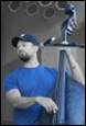 A person playing a bass

Description automatically generated