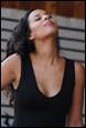 A person in a black tank top

Description automatically generated