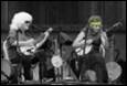A group of people playing instruments

Description automatically generated