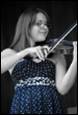 A person playing a violin

Description automatically generated