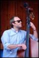 A person playing a double bass

Description automatically generated