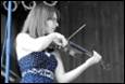 A person playing a violin

Description automatically generated