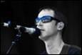 A person singing into a microphone

Description automatically generated