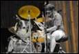 A person playing a drum set

Description automatically generated
