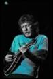 A person playing a guitar

Description automatically generated
