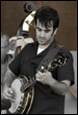 A person playing a guitar

Description automatically generated
