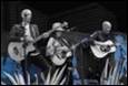 A group of people playing instruments

Description automatically generated