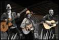 A group of people playing instruments

Description automatically generated