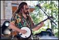 A person playing a banjo

Description automatically generated