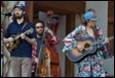 A group of people playing instruments

Description automatically generated