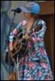 A person playing a guitar

Description automatically generated