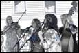 A group of people playing instruments

Description automatically generated