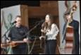 A group of people playing instruments

Description automatically generated